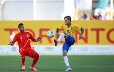 HAMILTON, CANADA - JULY 16:  Euller of Brazil (R) kicks the ball over the mark of Ray Sandoval of Peru (L) during a group A match between Brazil and Peru during the Toronto 2015 Pan Am Games at Tim Hortins Field on July 16, 2015 in Hamilton, Cnada. (Photo by William Volcov/Brazil Photo Press/LatinContent/Getty Images)