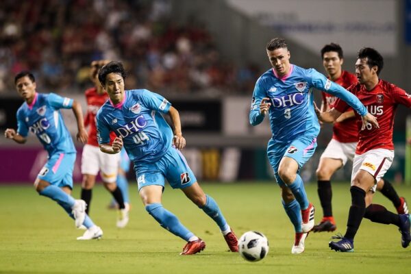 TOSU, JAPAN - AUGUST 11:  (EDITORIAL USE ONLY) #9 Fernando Torres and #44 Kanazaki Mu in action during the J.League J1 match between Sagan Tosu and Urawa Red Diamonds at Best Amenity Stadium on August 11, 2018 in Tosu, Saga, Japan.  (Photo by Zhizhao Wu/Getty Images)